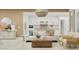 Open concept living room featuring modern lighting fixtures, neutral decor and an eat-in kitchen area at 3780 E Gold Mountain Ave, San Tan Valley, AZ 85143