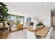 Open-concept living space with dining area, modern decor, and abundant natural light creating a welcoming atmosphere at 469 W Freedom St, Florence, AZ 85132
