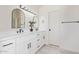 Bathroom features double sinks, modern black hardware, and wood-look tile at 4933 E Downing St, Mesa, AZ 85205