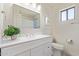Well-lit bathroom with a modern sink, a stylish mirror, and contemporary fixtures at 4933 E Downing St, Mesa, AZ 85205