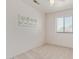 Neutral bedroom featuring a light ceiling fan, window with blinds, and carpeted floor at 4933 E Downing St, Mesa, AZ 85205