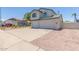 Two-story home with a three car garage and low-maintenance desert landscaping at 4933 E Downing St, Mesa, AZ 85205