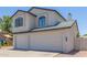 Charming two-story home featuring a three-car garage and well maintained landscaping at 4933 E Downing St, Mesa, AZ 85205