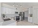Bright, updated kitchen with stainless steel appliances and modern white cabinetry at 4933 E Downing St, Mesa, AZ 85205