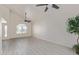 Open living space featuring vaulted ceilings, contemporary flooring, and large windows at 4933 E Downing St, Mesa, AZ 85205