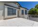 Exterior view of a patio with white stucco, a fence, and blue sky above at 4933 E Downing St, Mesa, AZ 85205