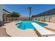 A refreshing pool and spa are a highlight of this home’s backyard with ample room for lounging and entertaining at 4933 E Downing St, Mesa, AZ 85205