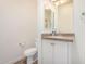 Bathroom featuring a vanity with granite countertops, white cabinets, a toilet, and a mirror at 5450 E Deer Valley Dr # 1211, Phoenix, AZ 85054