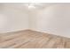 A bright bedroom with hardwood floors, a ceiling fan, and neutral-colored walls at 5450 E Deer Valley Dr # 1211, Phoenix, AZ 85054