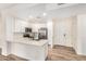 Bright kitchen with stainless appliances, white cabinets, and spacious center island at 5450 E Deer Valley Dr # 1211, Phoenix, AZ 85054