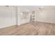 Open-concept living room showcasing wood floors, kitchen view, and modern lighting at 5450 E Deer Valley Dr # 1211, Phoenix, AZ 85054