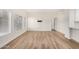 Spacious living room with wood flooring, white walls and many bright windows at 5450 E Deer Valley Dr # 1211, Phoenix, AZ 85054