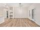 Well lit living room featuring wood floors, desk space, and access to the outdoors at 5450 E Deer Valley Dr # 1211, Phoenix, AZ 85054