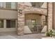 Covered patio with stone accents, offering a cozy outdoor space at 5450 E Deer Valley Dr # 1211, Phoenix, AZ 85054