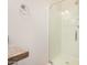 Bathroom with shower, glass door, granite countertop, and a towel ring at 5450 E Deer Valley Dr # 1211, Phoenix, AZ 85054