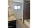 Bathroom featuring vanity with granite countertop and shower with tile surround at 647 W Mission Dr, Chandler, AZ 85225