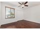 Bright bedroom features a ceiling fan, window with blinds, and a closet with sliding doors at 647 W Mission Dr, Chandler, AZ 85225