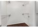 Spacious walk-in closet features white walls, wood floors, and plenty of storage space with chrome racks and shelving at 647 W Mission Dr, Chandler, AZ 85225