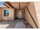 Inviting front entryway showcasing a secure screen door, stone accents, and stylish accents at 647 W Mission Dr, Chandler, AZ 85225