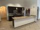 This open kitchen features modern appliances, granite countertops, and beautiful pendant lighting at 647 W Mission Dr, Chandler, AZ 85225