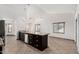 Open kitchen with dark wood cabinets, granite counters, stainless steel appliances, and a functional island at 647 W Mission Dr, Chandler, AZ 85225