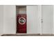 Bright laundry closet features a bright red washer and dryer with shelving at 647 W Mission Dr, Chandler, AZ 85225