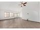 Spacious living room with tile flooring and multiple windows providing ample natural light at 647 W Mission Dr, Chandler, AZ 85225
