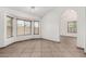 Bright living room featuring tile floors, a bay window and archway to another room at 647 W Mission Dr, Chandler, AZ 85225