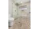 Modern shower with glass surround, built-in bench and pebble tile floor at 647 W Mission Dr, Chandler, AZ 85225