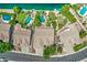 High angle view of waterfront homes with sparkling pools and lush landscaping in a serene residential area at 694 W Beechnut Dr, Chandler, AZ 85248