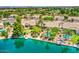 Expansive aerial view of waterfront homes showcasing private pools, landscaping, and a serene lakeside community at 694 W Beechnut Dr, Chandler, AZ 85248