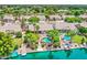 Scenic aerial view of homes along a waterfront, featuring pools, boat docks, and lush greenery at 694 W Beechnut Dr, Chandler, AZ 85248