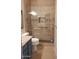 Bathroom featuring tile shower with glass doors and granite countertop at 694 W Beechnut Dr, Chandler, AZ 85248