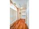 Walk-in closet featuring wood floors, shelves and curtains at 694 W Beechnut Dr, Chandler, AZ 85248