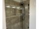 Bathroom featuring large tiled shower with glass door and niche at 694 W Beechnut Dr, Chandler, AZ 85248