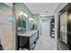 Bathroom showing vanity with dual sinks, marble countertops, closet, and walk-in shower at 7246 E Virginia Ave, Scottsdale, AZ 85257