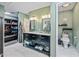 Bathroom featuring double sink vanity with storage, walk-in closet, and separate toilet area at 7246 E Virginia Ave, Scottsdale, AZ 85257