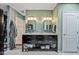 Bathroom with a double vanity, linen storage, and a walk-in shower at 7246 E Virginia Ave, Scottsdale, AZ 85257