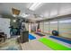 A functional garage space with work out area and storage at 7246 E Virginia Ave, Scottsdale, AZ 85257