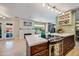 Open kitchen and living area featuring a large kitchen island and fireplace at 7246 E Virginia Ave, Scottsdale, AZ 85257