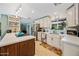 Bright kitchen featuring white cabinets, stainless steel appliances, and a center island at 7246 E Virginia Ave, Scottsdale, AZ 85257