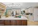Bright kitchen featuring a center island, stainless steel appliances, and updated cabinets at 7246 E Virginia Ave, Scottsdale, AZ 85257