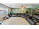 Spacious living room features tile flooring, ceiling fan, and a sizable leather sectional at 7246 E Virginia Ave, Scottsdale, AZ 85257