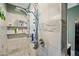 Walk-in shower showcasing multiple shower heads and built-in shelving for toiletries at 7246 E Virginia Ave, Scottsdale, AZ 85257