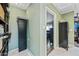 Spacious walk-in closet area leading to a bedroom; features built-in storage solutions at 7246 E Virginia Ave, Scottsdale, AZ 85257