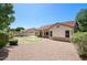 Backyard view featuring a grassy area surrounded by decorative rock at 8068 W Carlota Ln, Peoria, AZ 85383