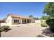 Backyard view featuring a grassy area surrounded by decorative rock at 8068 W Carlota Ln, Peoria, AZ 85383