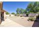 The backyard features decorative gravel and well-manicured landscaping at 8068 W Carlota Ln, Peoria, AZ 85383