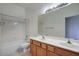 Bathroom featuring a double sink vanity and a shower-tub combo at 8068 W Carlota Ln, Peoria, AZ 85383