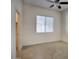 Bedroom featuring neutral walls, ceiling fan, carpet flooring, and large window at 8068 W Carlota Ln, Peoria, AZ 85383